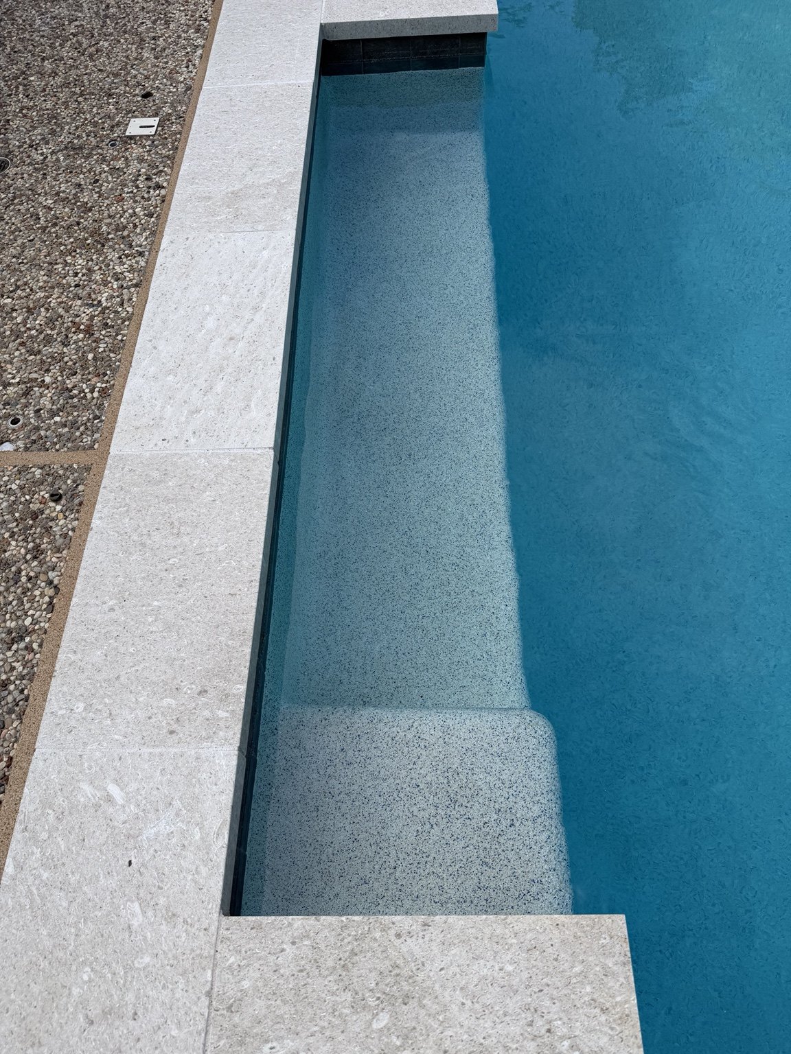 Close-up of coping and underwater bench